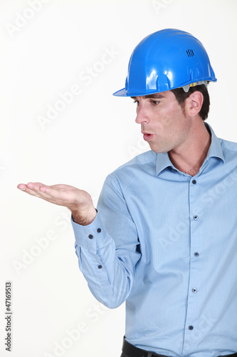 Engineer blowing an invisible object