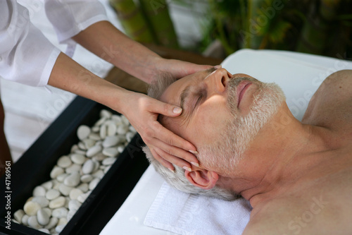 Man receiving head massage at day spa