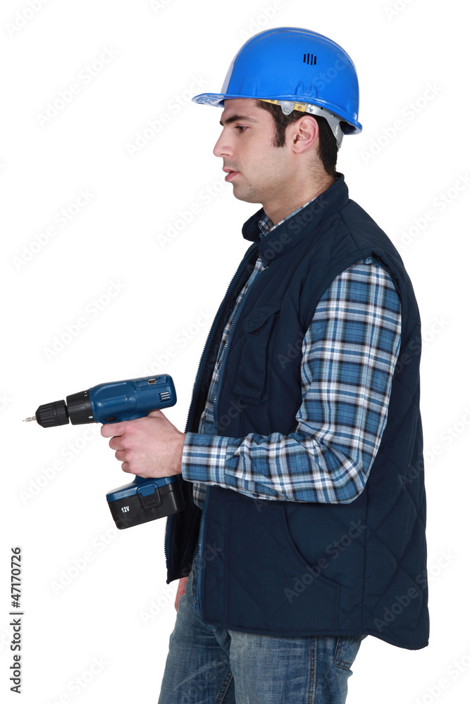 craftsman holding a drill