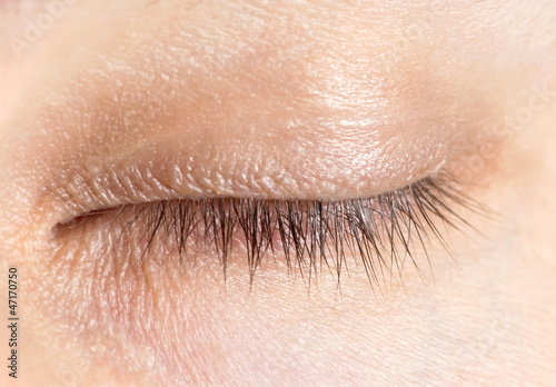 Close up of a mans closed eyes