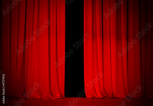 red curtain on theater or cinema stage slightly open