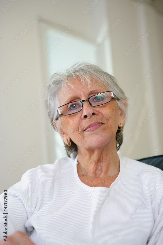 Elderly lady relaxing at home Elderly lady relaxing at home