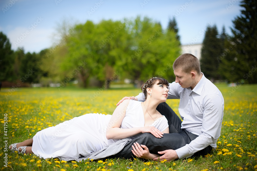 Girl and boy lying on the grass Girl and boy lying on the grass