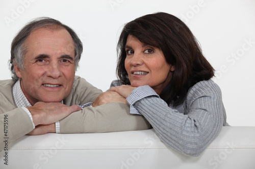 Couple on their sofa.