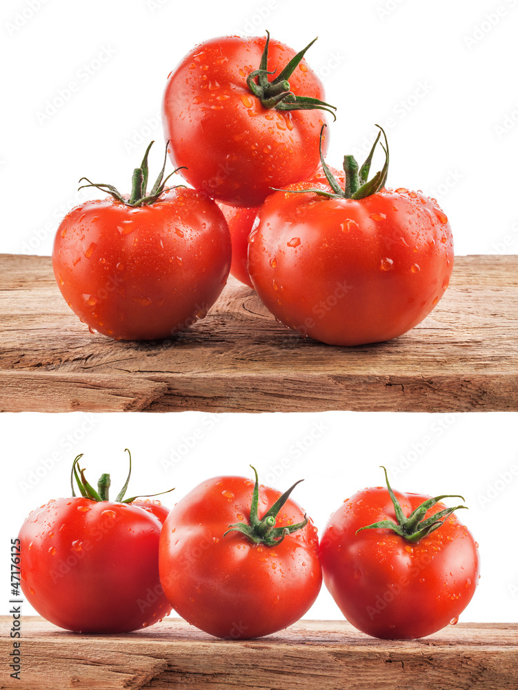 Collection of Tomatoes on the old wooden board with water drops Collection of Tomatoes on the old wooden board with water drops