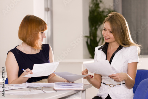 Woman advises clients in the office