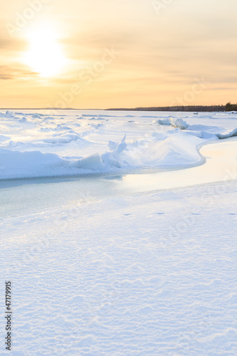 Ice hummocks on winter coast of Barents sea
