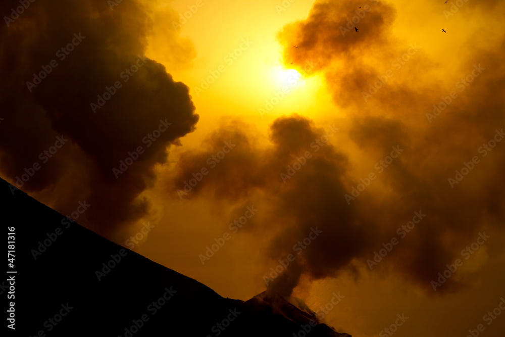smoking volcano at sunset smoking volcano at sunset