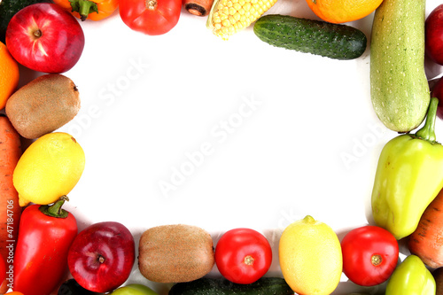 The frame made of vegetables and fruits on a white background