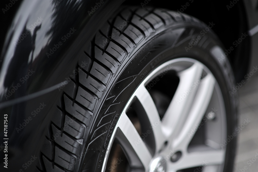 Car wheel on a car - closeup Car wheel on a car - closeup