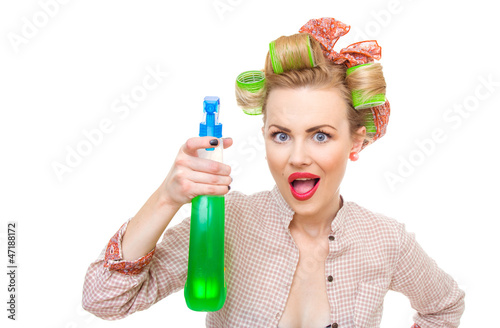 housewife / woman spraying the cleaner on you, isolated o nwhite photo