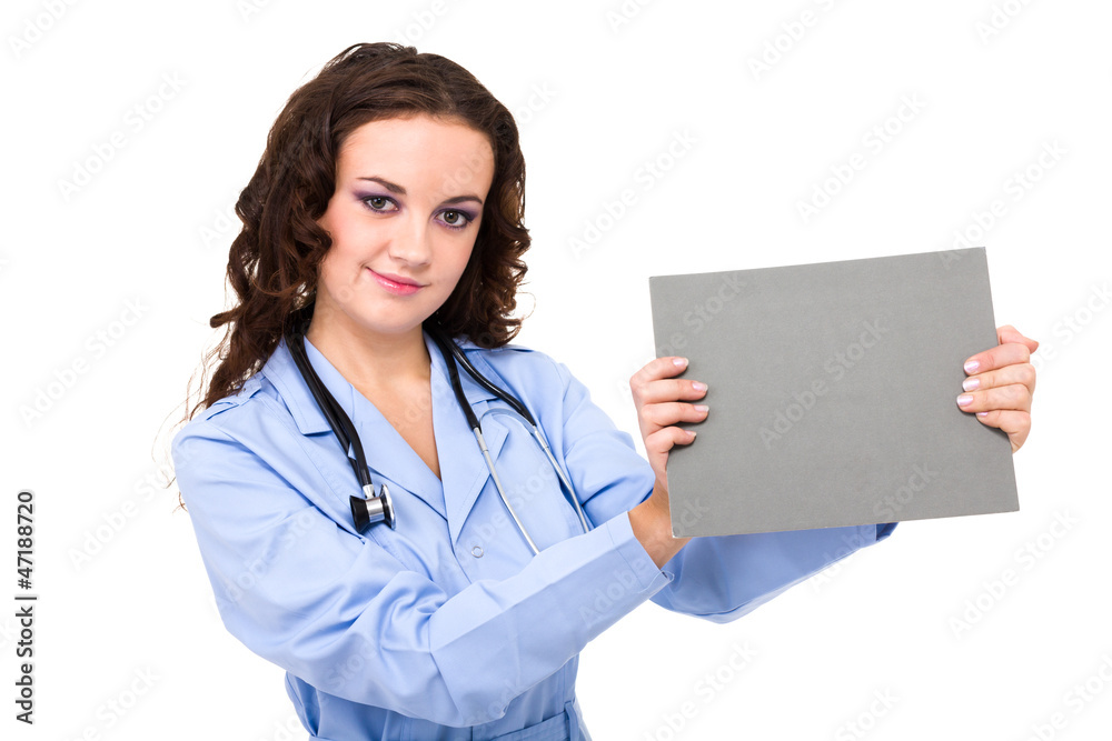 Young female doctor holding a blank