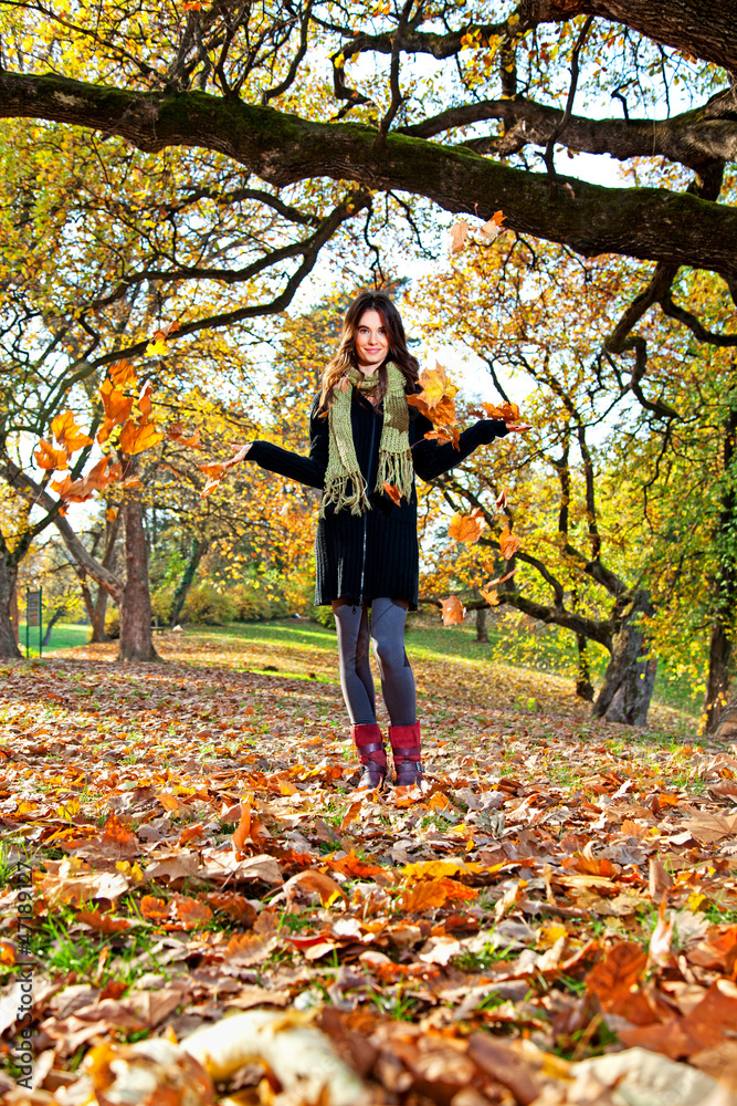 Happy young pretty woman at the autumn park. Happy young pretty woman at the autumn park.