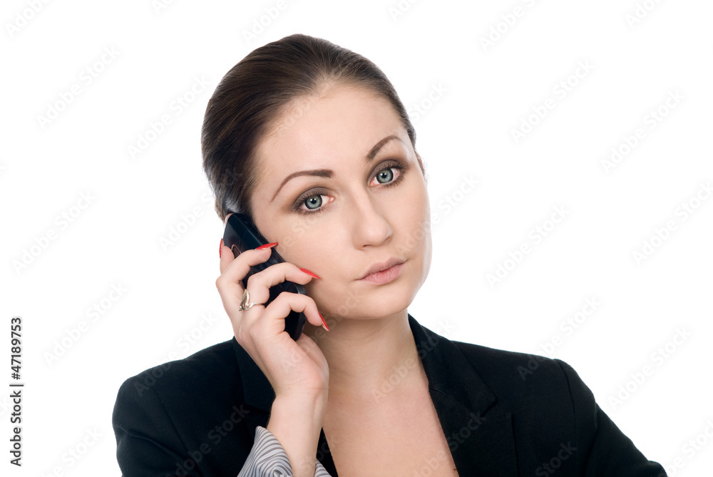 Businesswoman concentrating on cellphone call Businesswoman concentrating on cellphone call