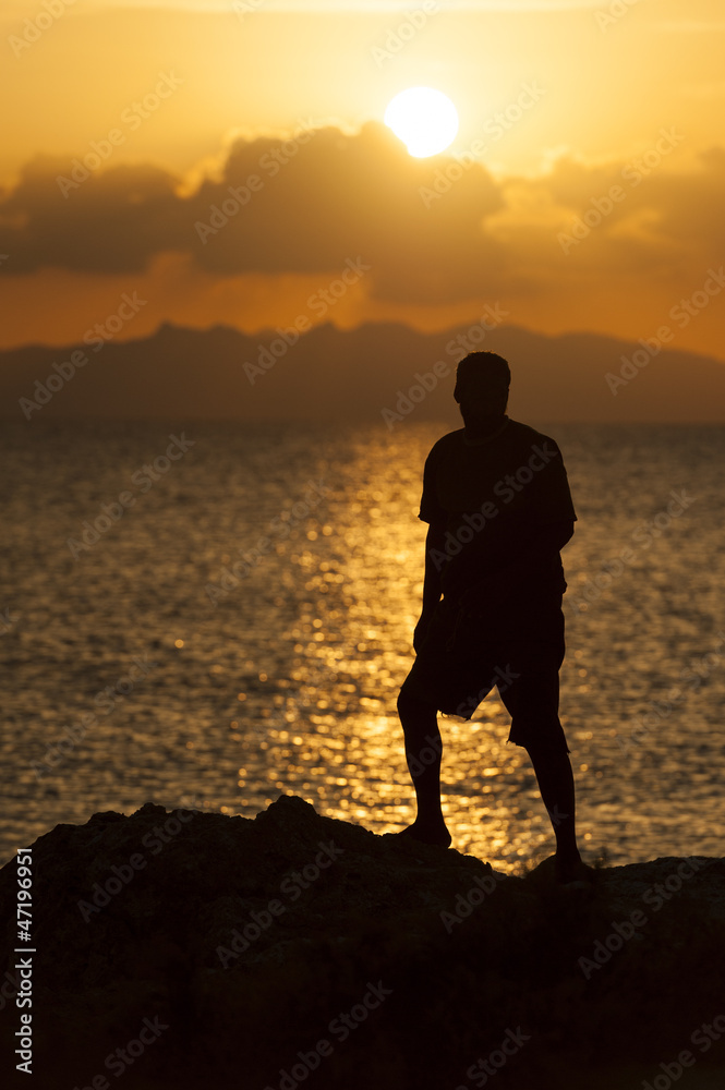 Silhouette of a person against sunset