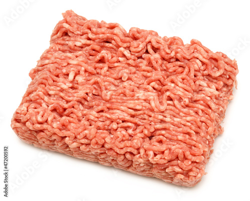 Isolated pease of raw minced beef on white background