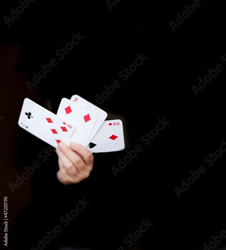 hands holding playing cards