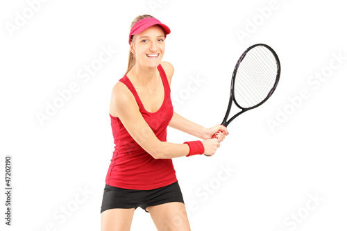 A female tennis player holding a racket