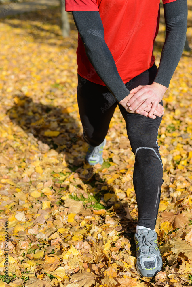 Sportsman stretching legs