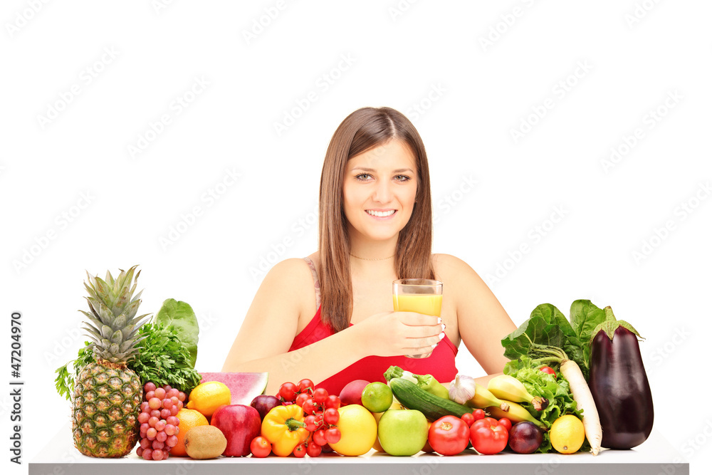 Beautiful young woman with pile of fruit and vegetables Beautiful young woman with pile of fruit and vegetables