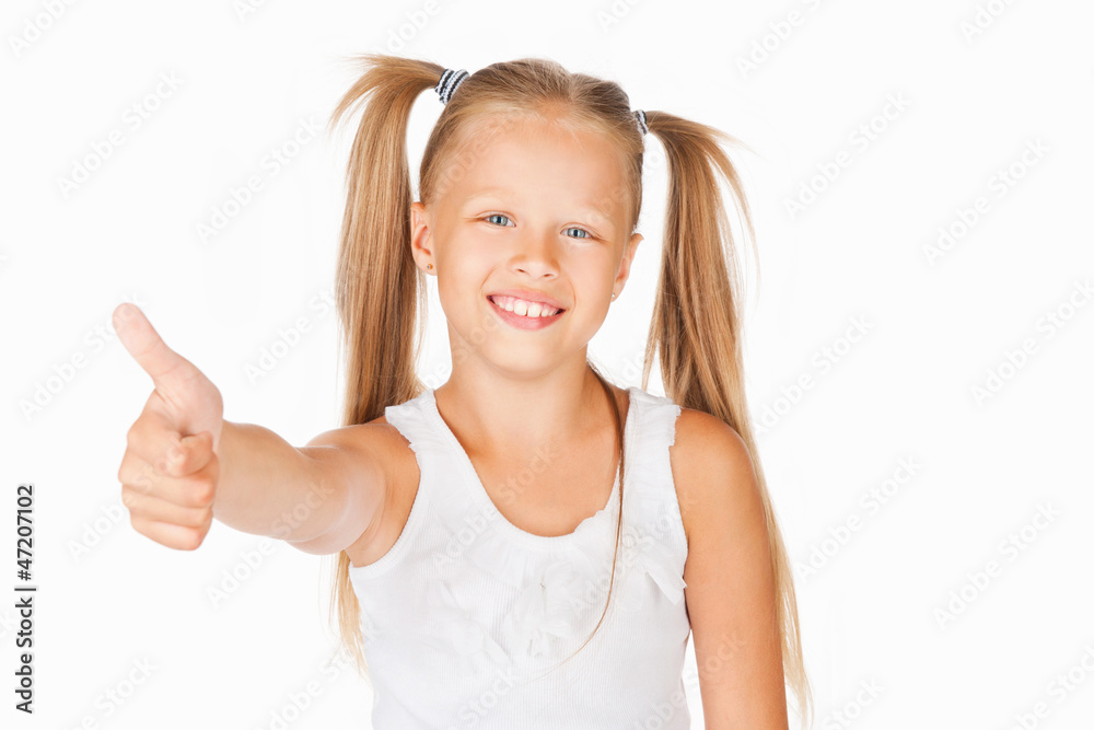 Beautiful girl showing thumbs up, on a gray background Beautiful girl showing thumbs up, on a gray background