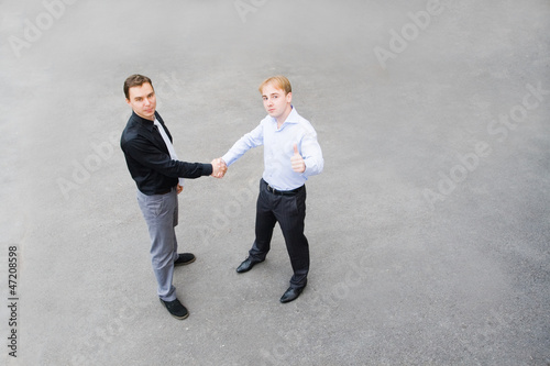 business partners concluded a bargain on the street