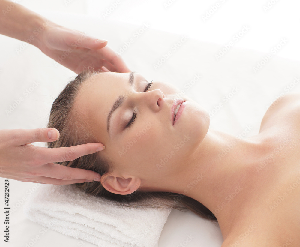 Portrait of a young woman laying on a spa massage Portrait of a young woman laying on a spa massage