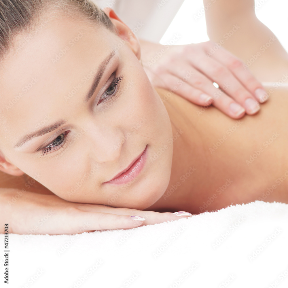 A young woman laying on a spa massage procedure