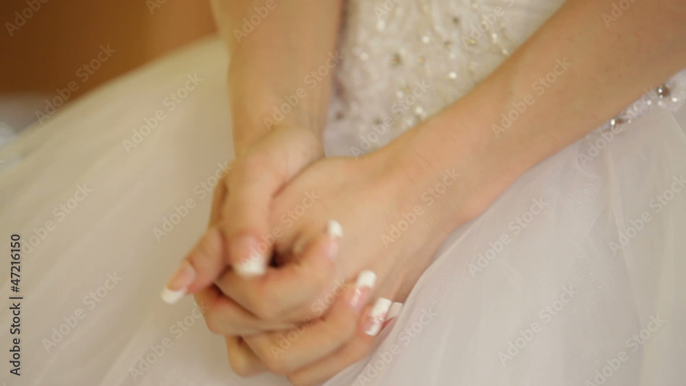 Bride dressing a wedding dress with a corset Bride dressing a wedding dress with a corset