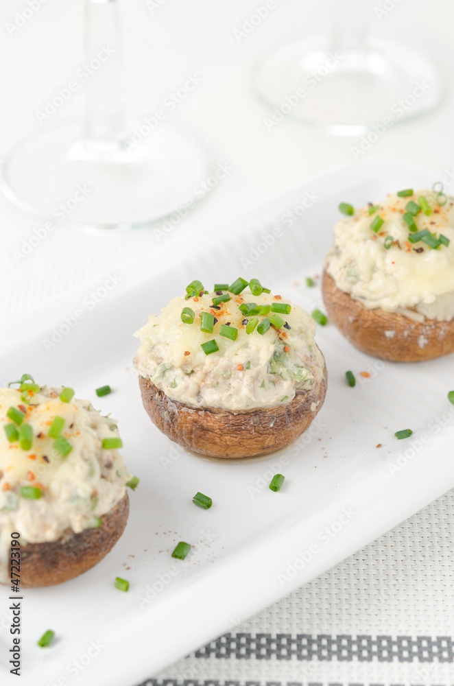 Stuffed mushrooms, baked with cheese and herbs, selective focus