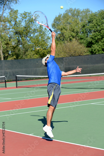 Mature tennis player during a match