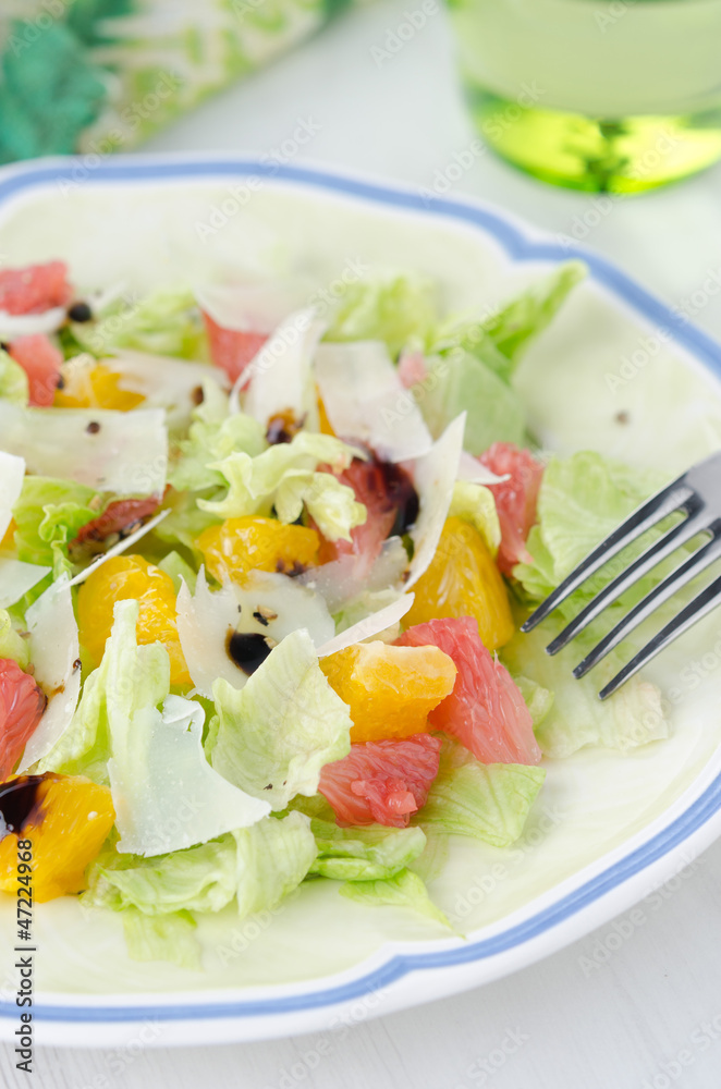 Salad with grapefruit, oranges, iceberg lettuce and cheese Salad with grapefruit, oranges, iceberg lettuce and cheese