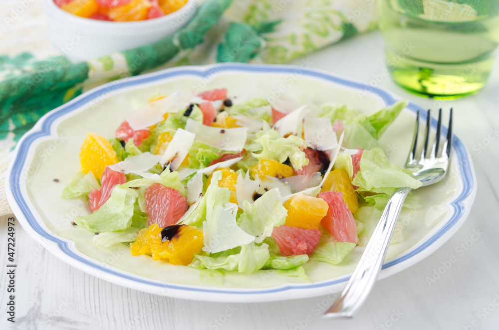 Salad with grapefruit, oranges, iceberg lettuce and cheese Salad with grapefruit, oranges, iceberg lettuce and cheese