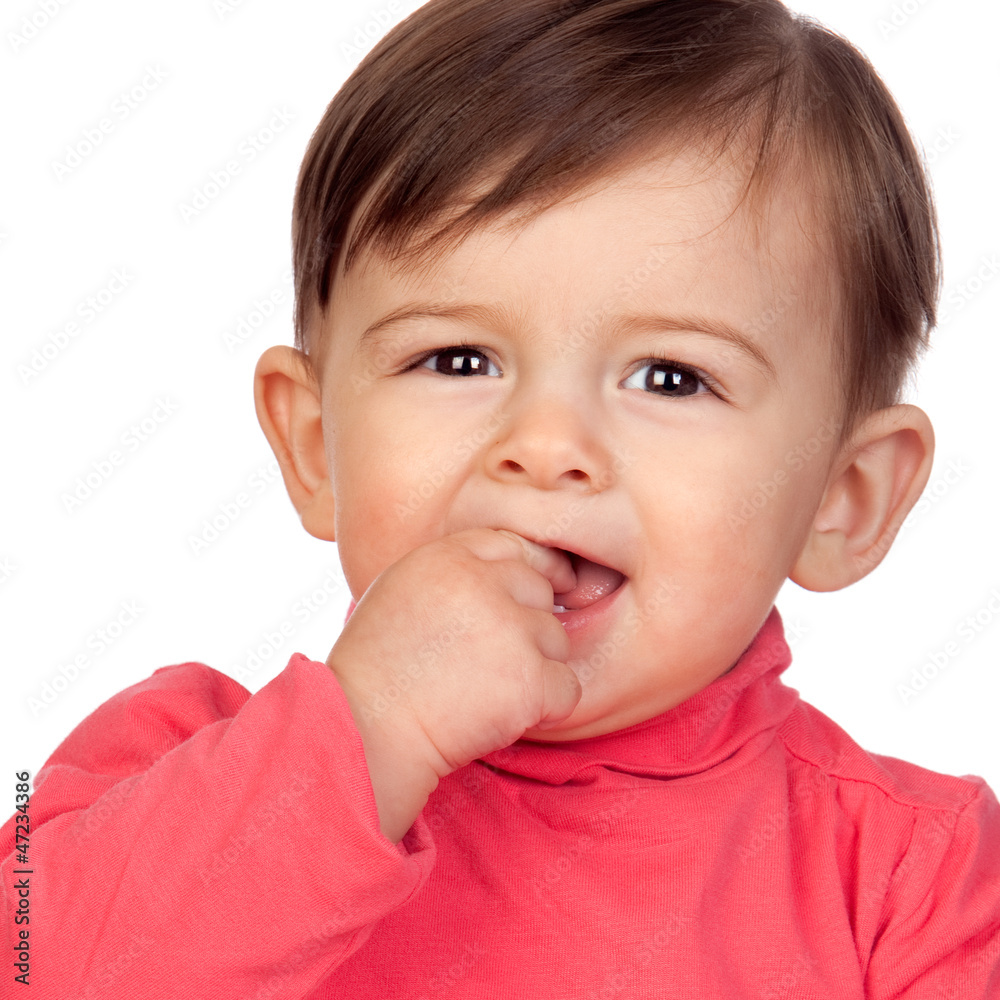 Adorable baby girl with her hand in mouth Adorable baby girl with her hand in mouth