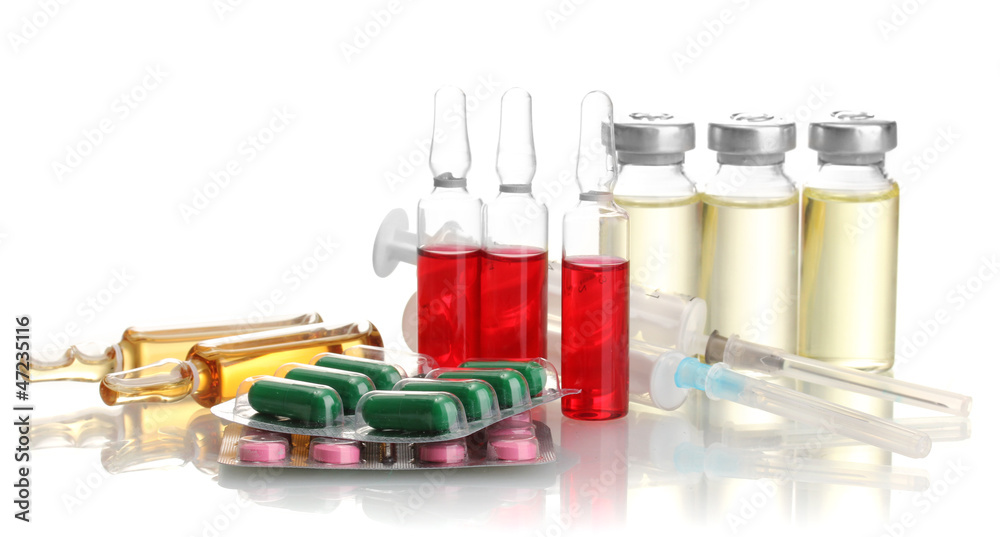 medical ampules, pills and syringes, isolated on white medical ampules, pills and syringes, isolated on white