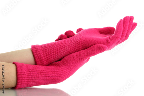 woman knitted gloves on hands, isolated on white photo