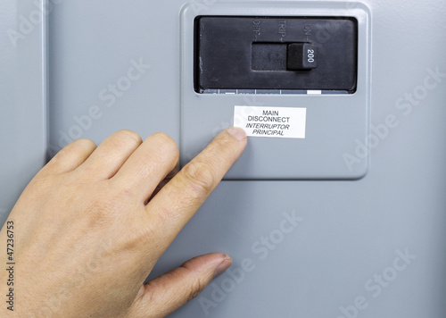 Fotografi Finger pointing to main circuit breaker