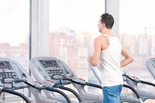 Man at the gym exercising. Run.