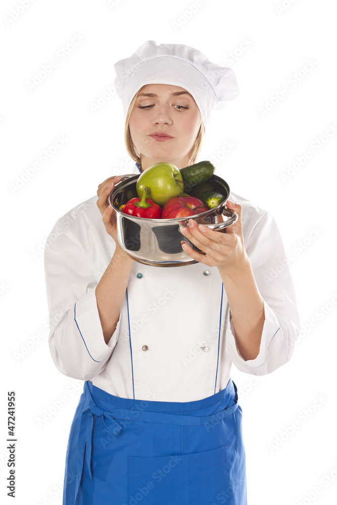 Cook with vegetables at the table, preparing Cook with vegetables at the table, preparing