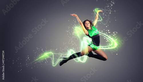 Young woman dancer. With lights effect. © Sergey Nivens