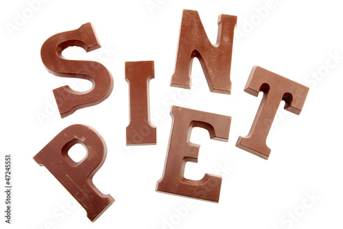 The words  SINT and PIET in chocolate letters isolated on white