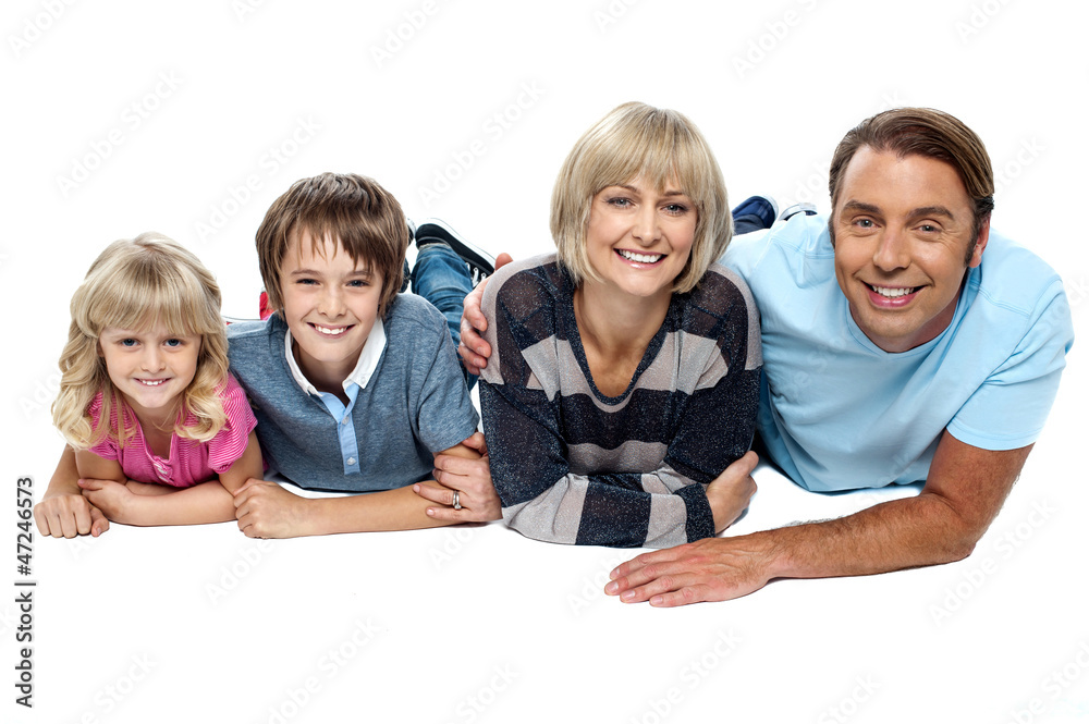 Smiling family of four relaxing on white background Smiling family of four relaxing on white background