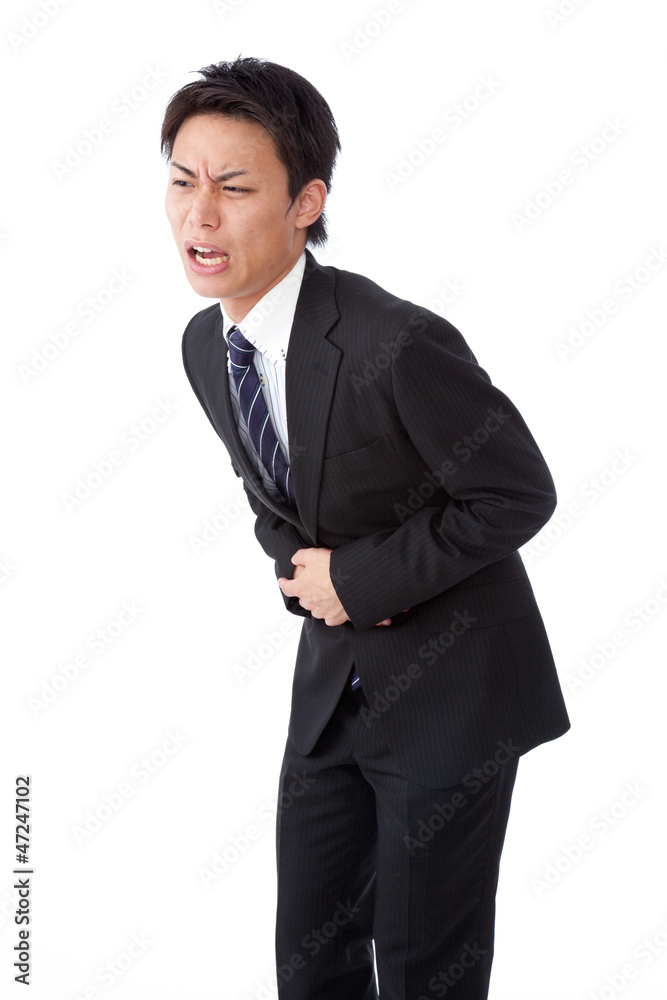 young businessman suffering from abdominal pain young businessman suffering from abdominal pain