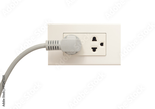 White electric socket on the wall. Close up.