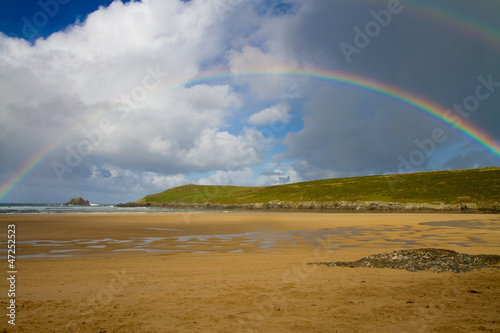 Rainbow at Crantock beach in Cornwall England UK