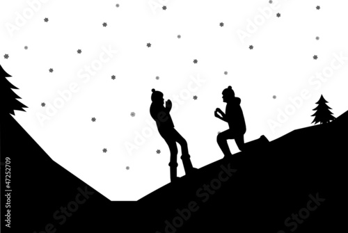 Romantic proposal on mountain in winter silhouette