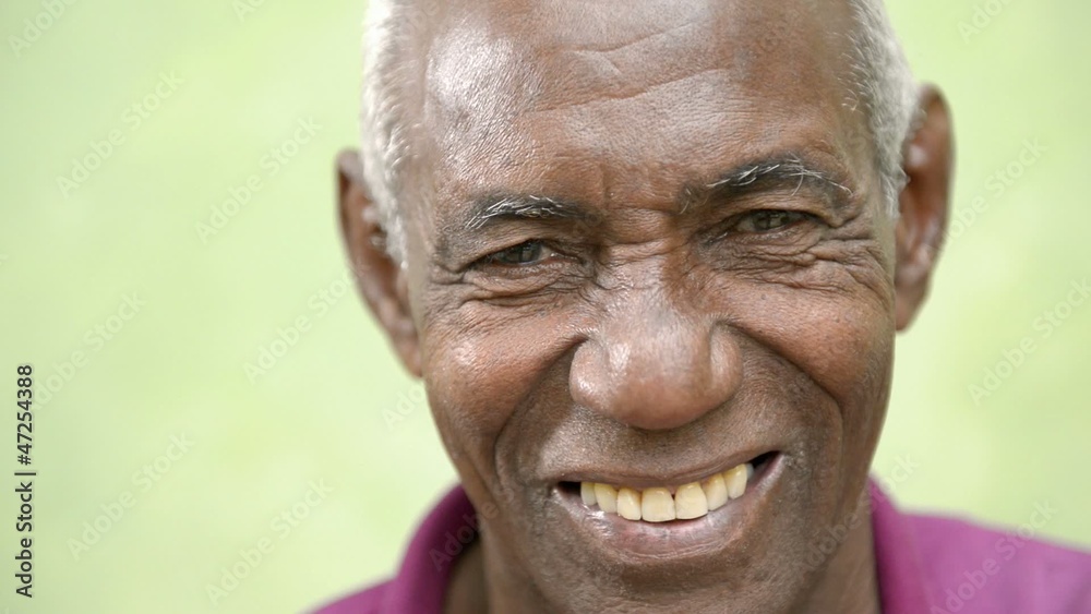 Senior people, portrait of happy old black man smiling at camera
