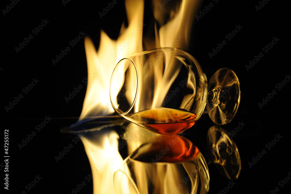 Cognag glass in fire - Brandy in flame