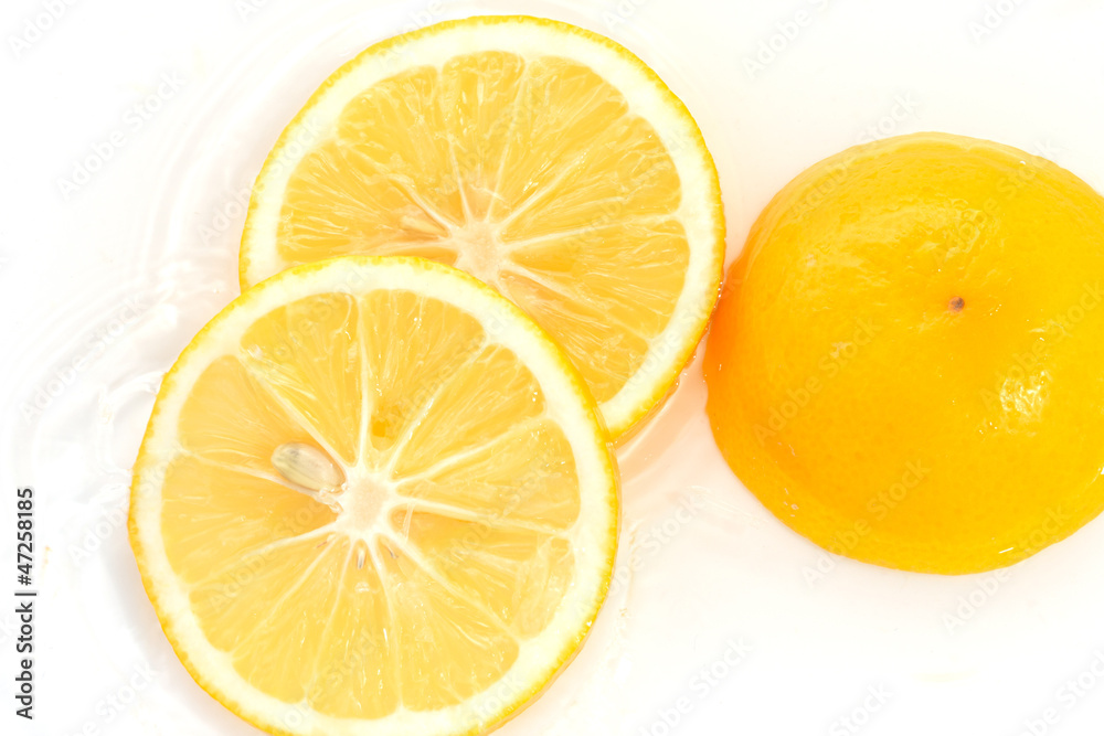 lemon in water on a white background lemon in water on a white background