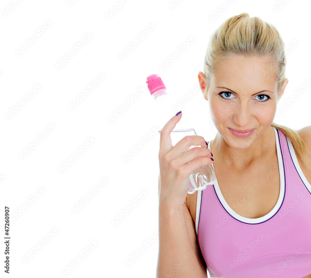 Pretty young female fitness trainer with bottle of water. Pretty young female fitness trainer with bottle of water.